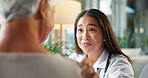 Happy woman, doctor and talking with elderly patient for medical diagnosis, results or healthcare service. Female person, health worker or senior care with smile for good news or checkup at clinic