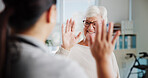 Elderly patient, woman and high five in physio for rehabilitation success, good news and health progress. Physical therapy, professional and celebration in clinic for healthcare recovery and healing