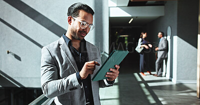 Buy stock photo Businessman, research and browsing with tablet at office building for company report or review. Man, employee or investor on technology in hallway for corporate analysis or communication at workplace