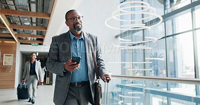 Buy stock photo Businessman, walking and phone with suitcase for travel, job opportunity or career trip at airport. Man, employee or traveler with mobile smartphone or luggage for business commute or flight app
