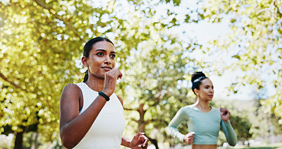 Buy stock photo Women, running and workout in park with fitness, exercise or support for endurance. Athlete, runner friends and challenge with marathon, training or development in nature for wellness and health goal