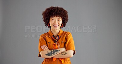 Buy stock photo Portrait, smile and woman in studio, arms crossed and stylish clothes on grey background. Face, happy person and model with space, pride and positive mindset with casual outfit and fashion with gen z