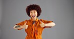 Portrait, happy woman and thumbs up for fashion, wink and retro style isolated on gray studio background. Person, smile and hand gesture with like emoji for support, agreement and feedback with space
