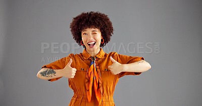 Buy stock photo Portrait, happy woman and thumbs up for fashion, wink and retro style isolated on gray studio background. Person, smile and hand gesture with like emoji for support, agreement and feedback with space