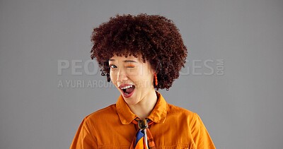 Buy stock photo Woman, smile and fashion with wink in studio portrait, flirt and playful with afro by background. Girl, model and happy with eye emoji, space or secret for retro style, confidence and pride in Brazil