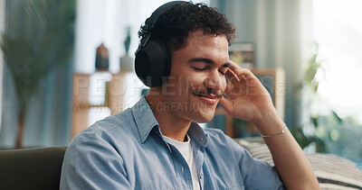 Buy stock photo Smile, music and man with headphones in living room for streaming service, kpop playlist or podcast. Technology, home or person listening to song, audiobook and sound with radio on weekend to relax