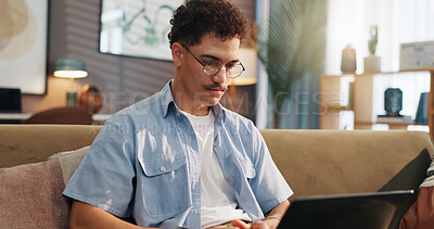 Buy stock photo Remote work, man and laptop on sofa for research, email draft or creative writing in home. Freelance writer, tech or connectivity in living room for article editing, proofreading story or publication