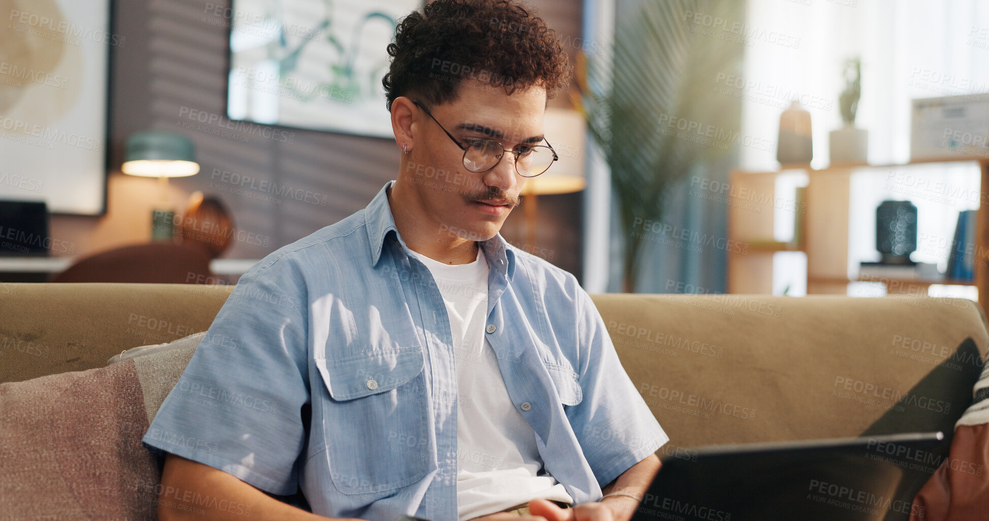 Buy stock photo Remote work, man and laptop on sofa for research, email draft or creative writing in home. Freelance writer, tech or connectivity in living room for article editing, proofreading story or publication