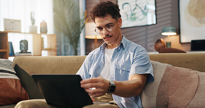 Buy stock photo Remote work, man and laptop on sofa for reading, email draft or creative writing in home. Freelance writer, tech or connectivity in living room for article editing, story research or publication