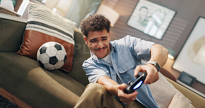 Buy stock photo Playing, video games and man with controller, home and fun with virtual sport in living room and online sports. Apartment, gamer and person with tech for entertainment, streaming and player on couch