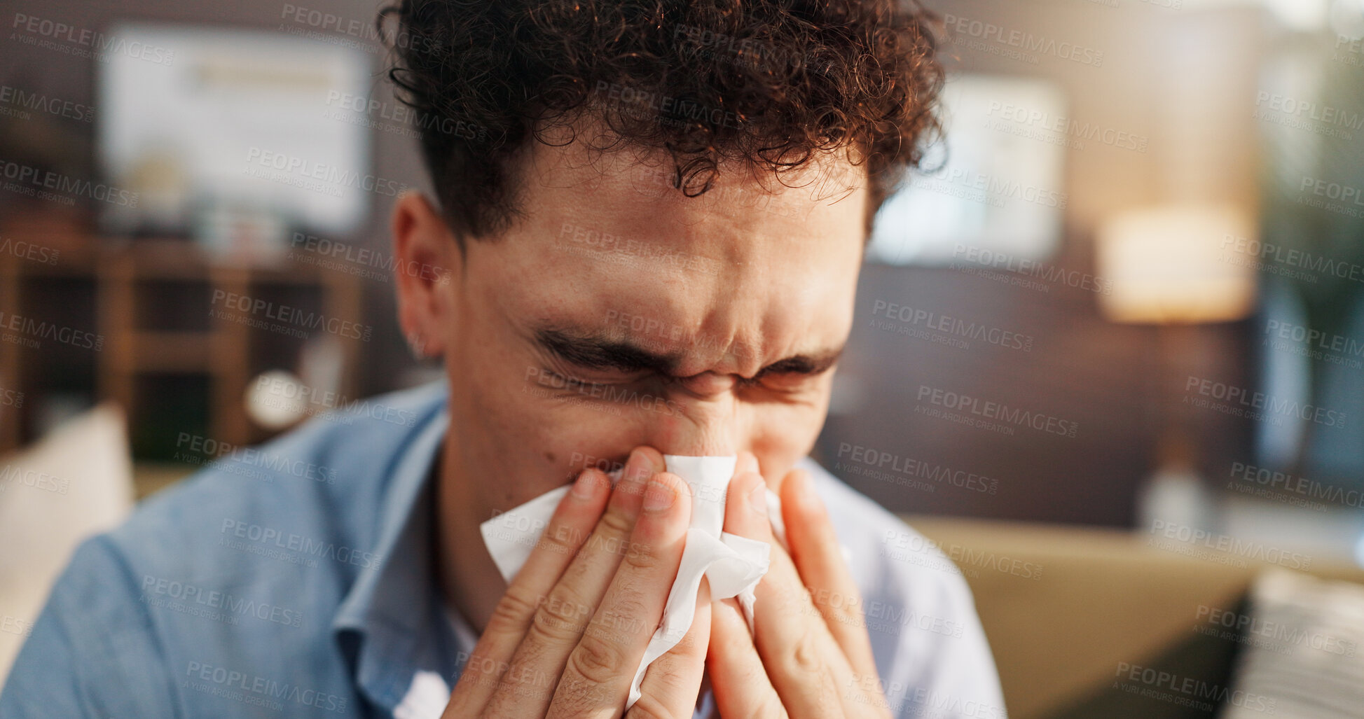 Buy stock photo Sick man, sofa and blowing nose with tissue for flu, cold or hayfever season at home. Male person, influenza and sinus with sneeze, allergy or viral infection for virus, bacteria or germs at house