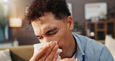 Buy stock photo Man, sofa and blowing nose with tissue for influenza, cold or hayfever season at home. Male person, sick or flu sinus with sneeze, allergy or viral infection for virus, bacteria or germs at house