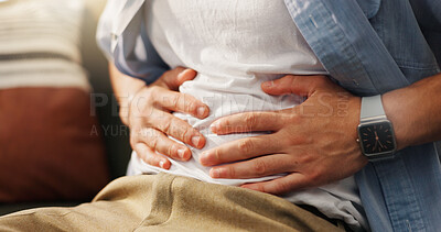 Buy stock photo Stomachache, hands and person in home, pain and man with food poisoning in living room or indigestion. Abdominal, cramps and discomfort on couch, gas and bloating in lounge, diarrhea or constipation