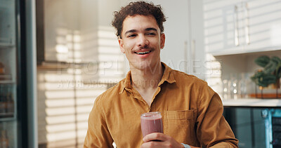 Buy stock photo Man, thinking and smile in home with smoothie, protein shake and beverage for gut health. Nutritionist, happy and glass in kitchen with detox drink, vitamin booster and benefits of meal supplement