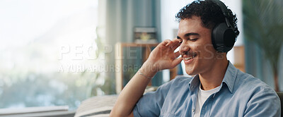 Buy stock photo Man, headphones and happy on sofa in home with space, relax and listening to music in living room. Person, smile and audio with streaming, subscription and inspiration on couch at lounge in house