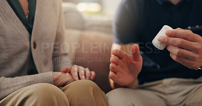 Buy stock photo Hands, old woman and caregiver with pills on sofa for illness management, prescription drugs or explain dosage. Homecare, patient and healthcare worker with medication discussion for health treatment