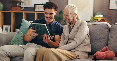 Buy stock photo Senior woman, nurse and tablet on sofa, happy and help for streaming movie in living room at apartment. Caregiver, elderly person and digital touchscreen for film, application and relax in retirement
