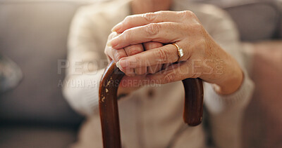 Buy stock photo Senior, woman and hands with cane for support, mobility or aid on sofa at retirement house. Closeup, elderly or person with a disability or walking stick for assistance or balance at old age home