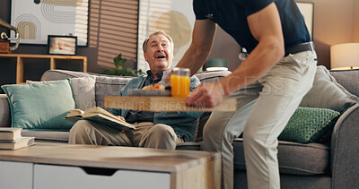 Buy stock photo Senior man, caregiver and sofa with breakfast for assisted living, homecare or service at retirement house. Male person, volunteer or nurse with food tray for elderly patient, juice or meal at home