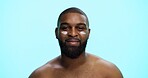 Portrait, cream and black man in studio, beauty and dermatology on blue background. African person, space and model with shine, creme and aesthetic with moisturiser, glow and facial spf with skincare