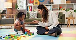 Therapist, woman and girl with clipboard, blocks and talk for evaluation, assessment or exam on floor. Person, psychologist and child with toys, advice and checklist for notes with point at clinic