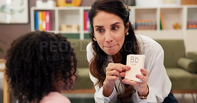 Buy stock photo Education, card or speech therapy with teacher and student in classroom for development or learning. Language, pointing or sounds with woman and child at school for assistance, growth or phonics