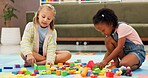 Building blocks, fun and kids in psychology waiting room with cognitive development or growth. Friends, creative and girl children playing with educational toys for sensory or motor skills at clinic.