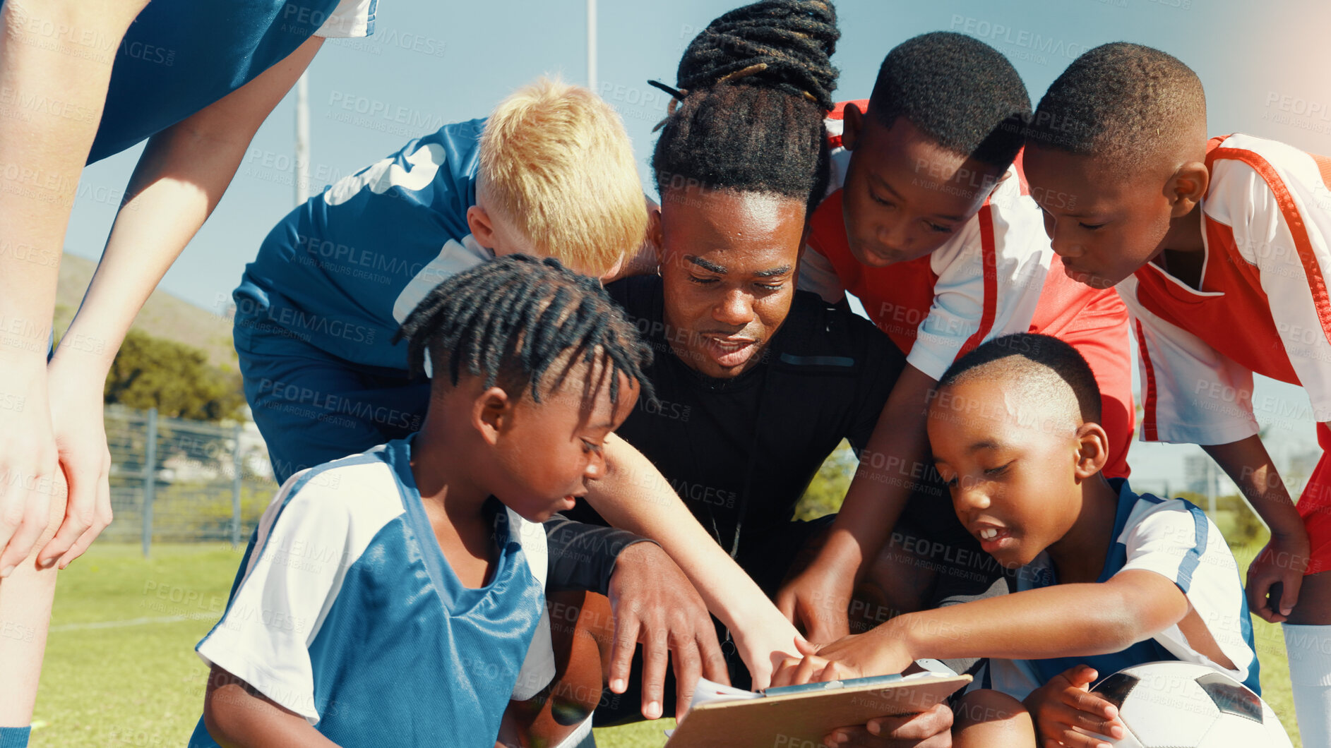 Buy stock photo Soccer, children and coach with clipboard for team, training and formation on field. Man, football group and planning game for strategy, discussion and exercise for tournament or goal practice