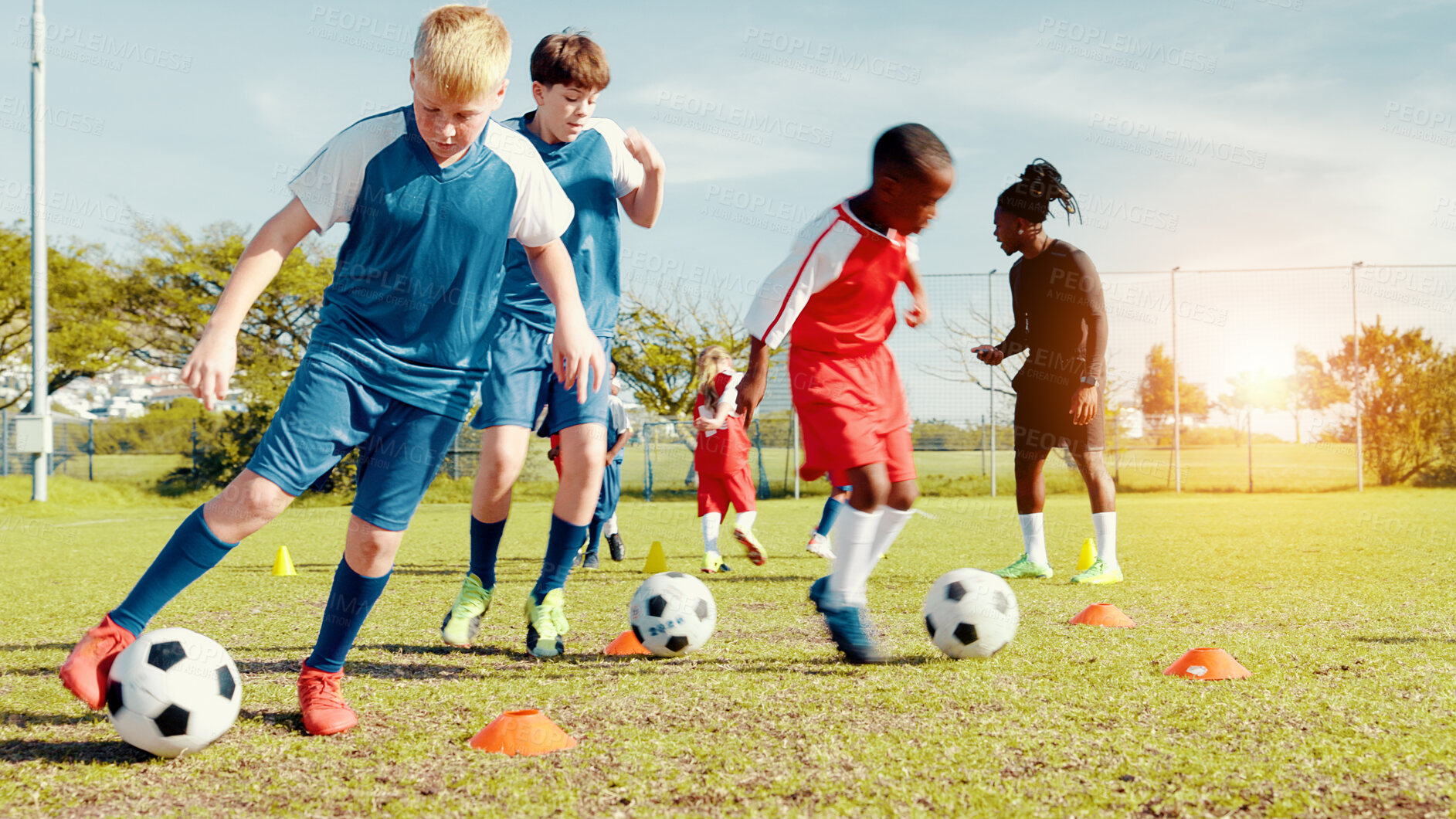 Buy stock photo Playing, soccer player and children with ball, kick and athlete with energy for practice in morning. Sports field, football and kids with sportswear for game, growth and development with fitness