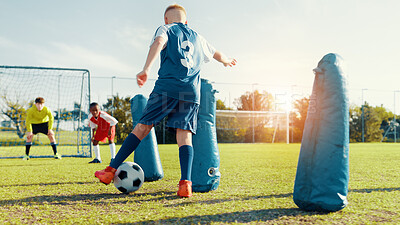 Buy stock photo Sports field, children and soccer player with skills, active and athlete with energy for match and cardio. Playing, football and kids with sportswear for game, growth and development with fitness