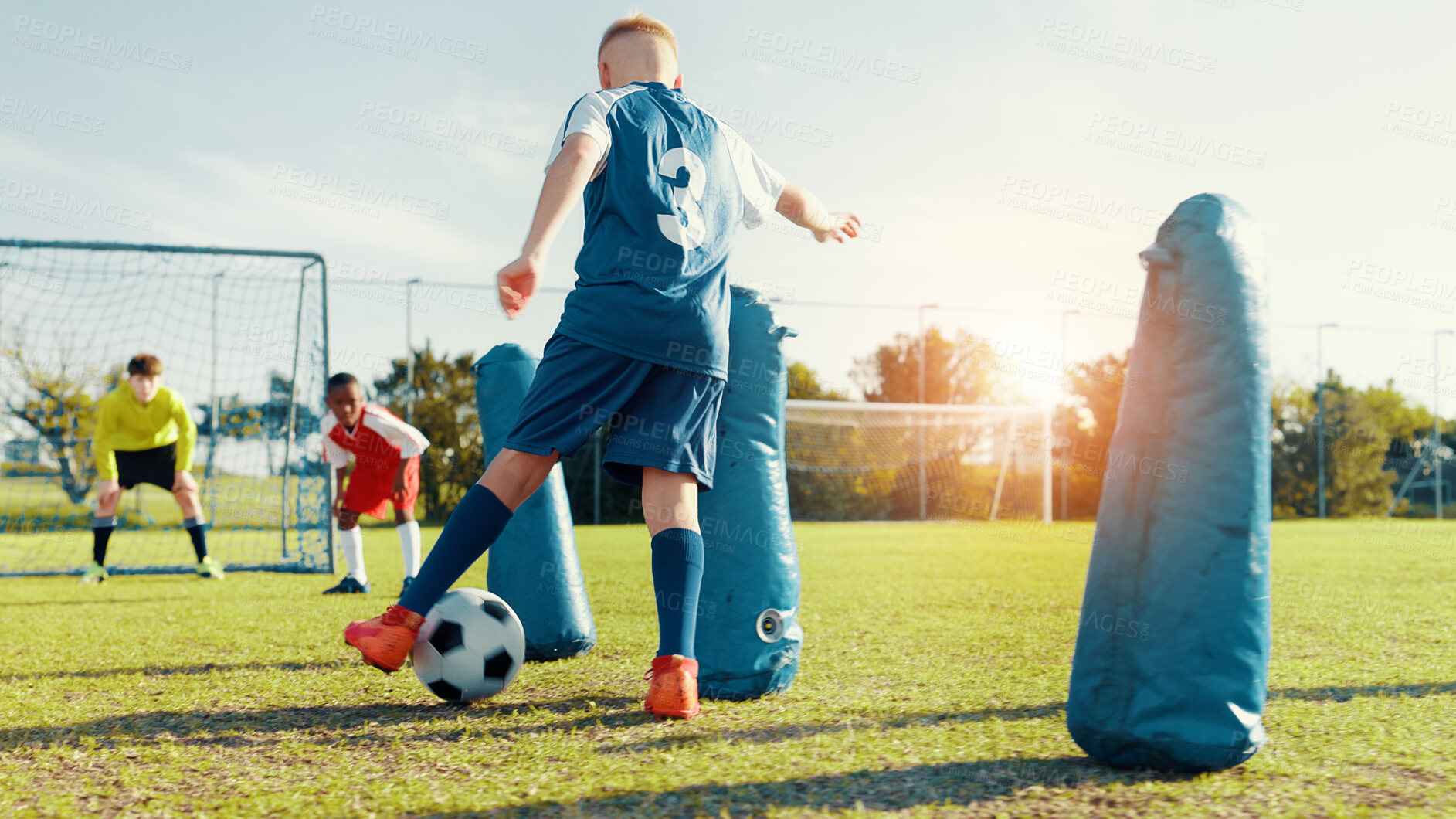 Buy stock photo Sports field, children and soccer player with skills, active and athlete with energy for match and cardio. Playing, football and kids with sportswear for game, growth and development with fitness
