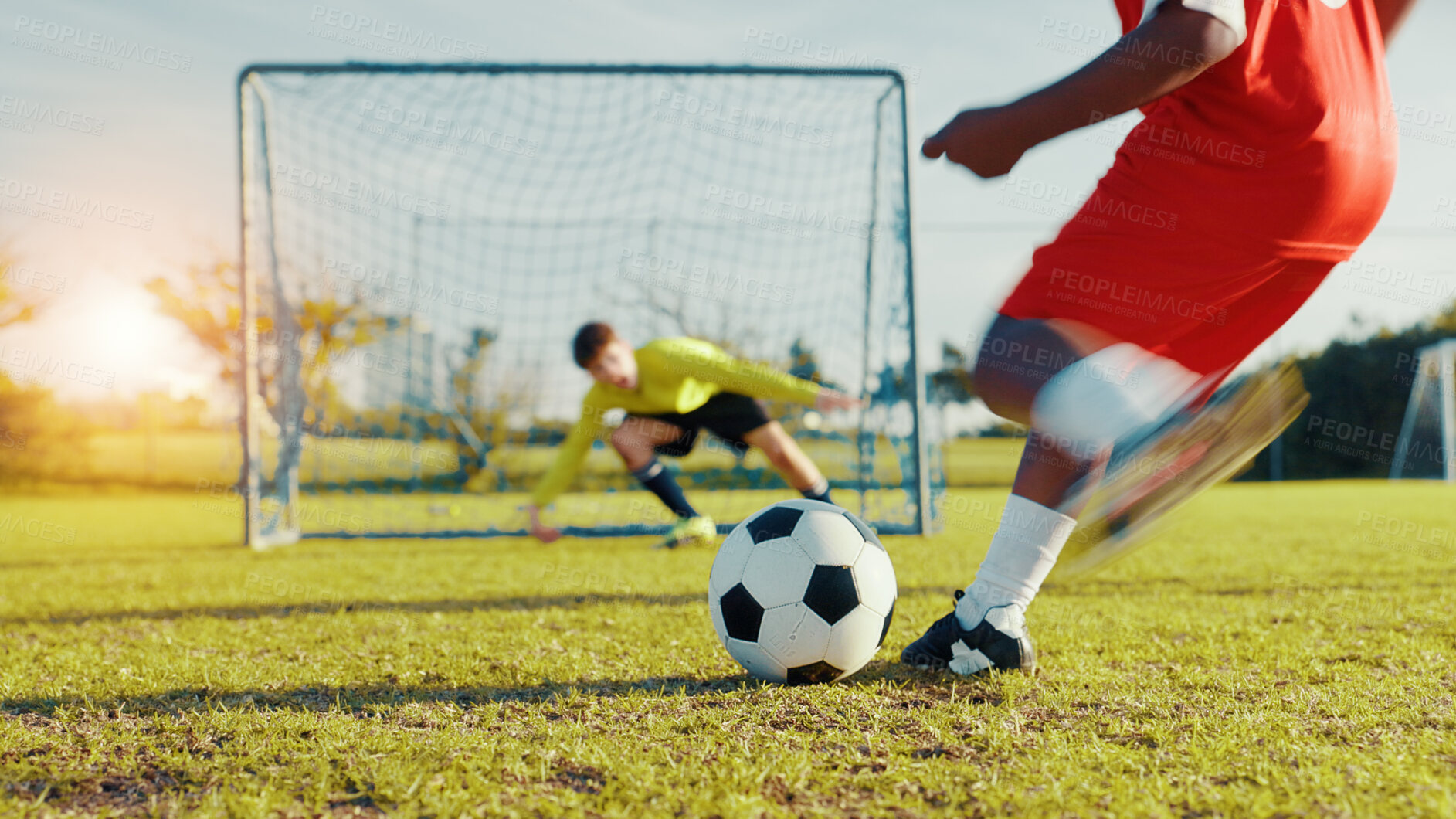 Buy stock photo Goal, soccer player and children with ball, kick and athlete with energy, cardio and practice in morning. Sports field, football and kids with sportswear for game, growth and development with fitness