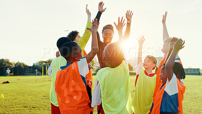 Buy stock photo Hands up, soccer and coach in huddle with happy kids on field for motivation, game plan or strategy. Excited, training and practice with children in celebration for sports, football player or support
