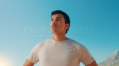 Buy stock photo Man, fitness and breathing with blue sky in nature for workout break, rest or exercise. Active, male person or runner with recovery or fresh air for outdoor cardio training, health and wellness