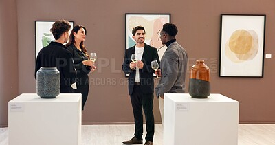 Buy stock photo People, art and meeting with wine at gallery for event, audience chat and talking for auction. Men, woman and stem glass with discussion, artwork collection and negotiation of exhibition showroom