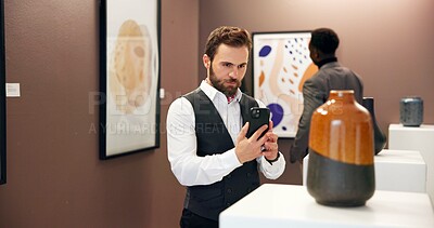 Buy stock photo Art gallery, photograph and man in museum with phone for social media, online post and creative blog. Auction, exhibition and person with picture of vase for research, artwork information and review