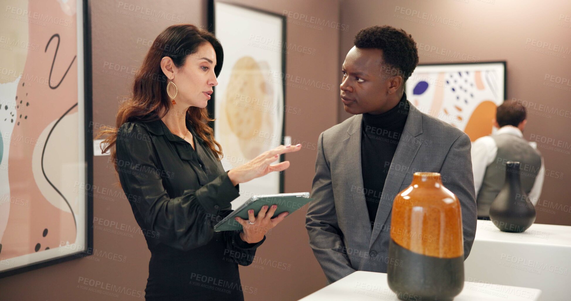 Buy stock photo Woman, man and vase with tablet in art gallery for negotiation, discussion and explain deal. People, ceramics and customer with museum, guide and display with culture, talent or sculpture at event