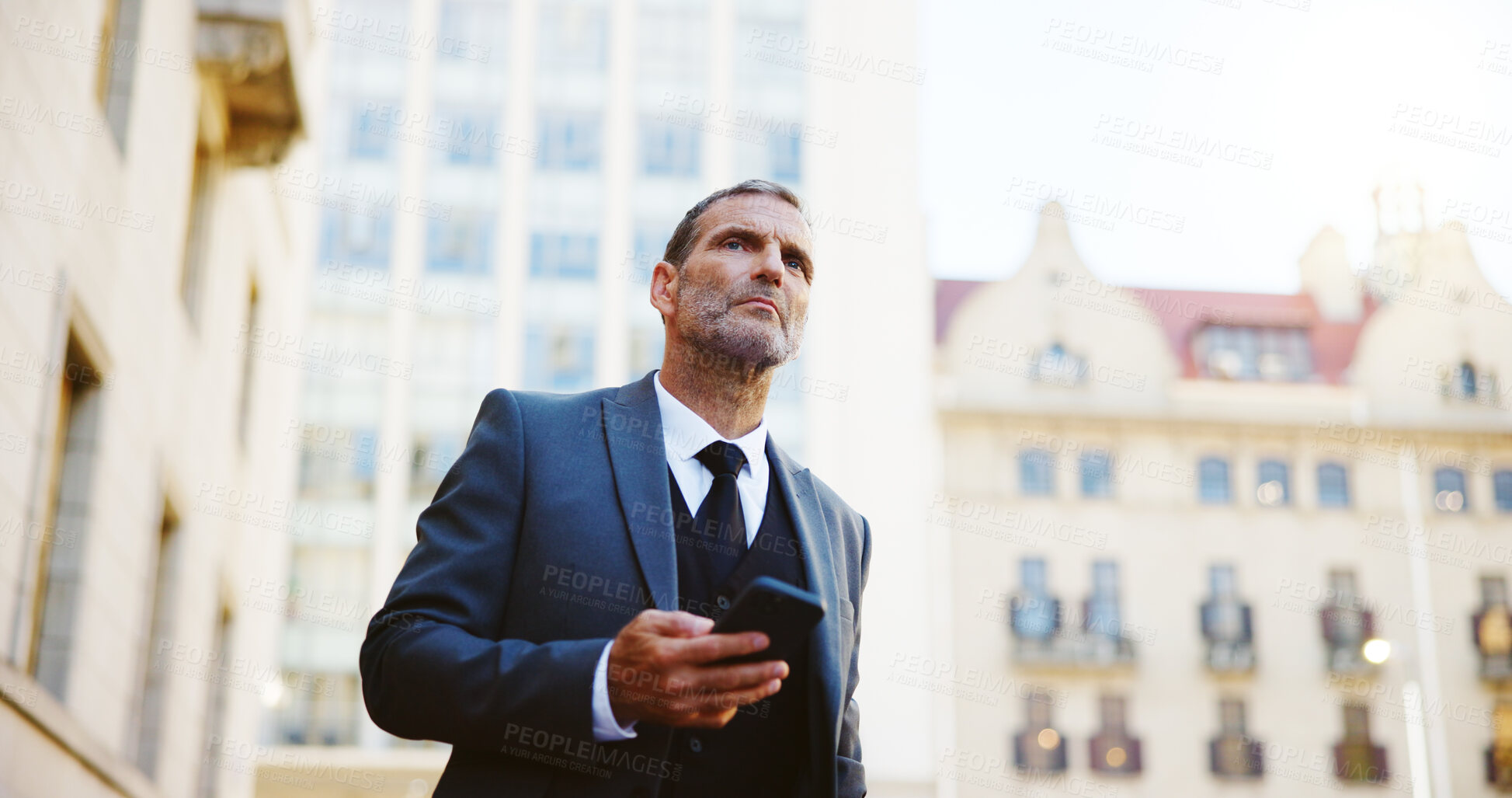 Buy stock photo Businessman, phone and waiting in city for taxi, cab ride or transportation to travel. Man, employee or mobile smartphone with app or lift for local commute, destination or location in an urban town