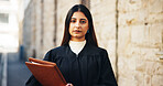 Portrait, lawyer and woman in city, folder and trial report with courtroom schedule. Face, person and attorney with file, documents and legal services with justice constitution and verdict claims