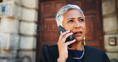 Buy stock photo Phone call, lawyer and woman in city, angry and negotiation with legal aid service. Outdoor, mature person and attorney with smartphone, discussion and folder for court case, serious and litigation
