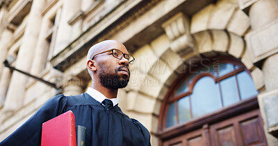 Buy stock photo Thinking, walk and judge and black man in city for trial report, policy legislation and legal documents. Lawyer idea, attorney paperwork and vision with person at courtroom outdoor in low angle