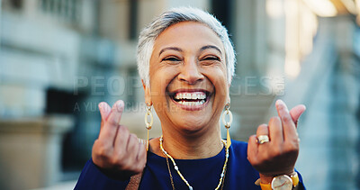 Buy stock photo Portrait, woman and laughing with finger heart for love, flirting emoji and share kindness. Happy, mature person or romance hand gesture of care symbol, showing gratitude and affection shape in city
