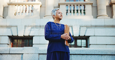 Buy stock photo Lawyer, documents and vision with business woman in city for court case files, trial assessment and attorney brief. Plead agreement, legal research and advocate paperwork with mature person thinking