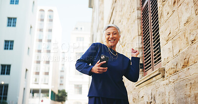 Buy stock photo Dance, excited and woman in city with phone, mature and good news for job opportunity at law firm. Music, happy and business lawyer in street with smile, smartphone and notification for success