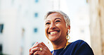 Mature businesswoman, happy and thinking in city with reflection, insight and low angle in street. Person, smile and excited for inspiration, perspective or decision on commute to workplace in Mexico