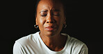 Closed eyes, sad and black woman in studio, crying and mental health on dark background. African person, mockup space or model with tears, anxiety and depression with grief, upset or stress with loss