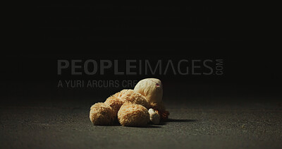 Buy stock photo Dark, shadow and teddy bear in studio for neglect, isolation and forgotten toy on ground. Night, floor and stuffed animal on black background for loss, abandonment space and unwanted with lost hope
