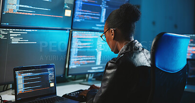 Buy stock photo Hacker, online and woman with computer, night and data for cyber espionage, system and phishing in office. Screen, typing and black person with tech for ransomware, spy and hacking for fraud or scam