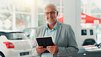 Businessman, portrait and smile with tablet for dealership, online and website for car rental service. Showroom, mature person and seller with tech for inventory information, vehicle shop and happy