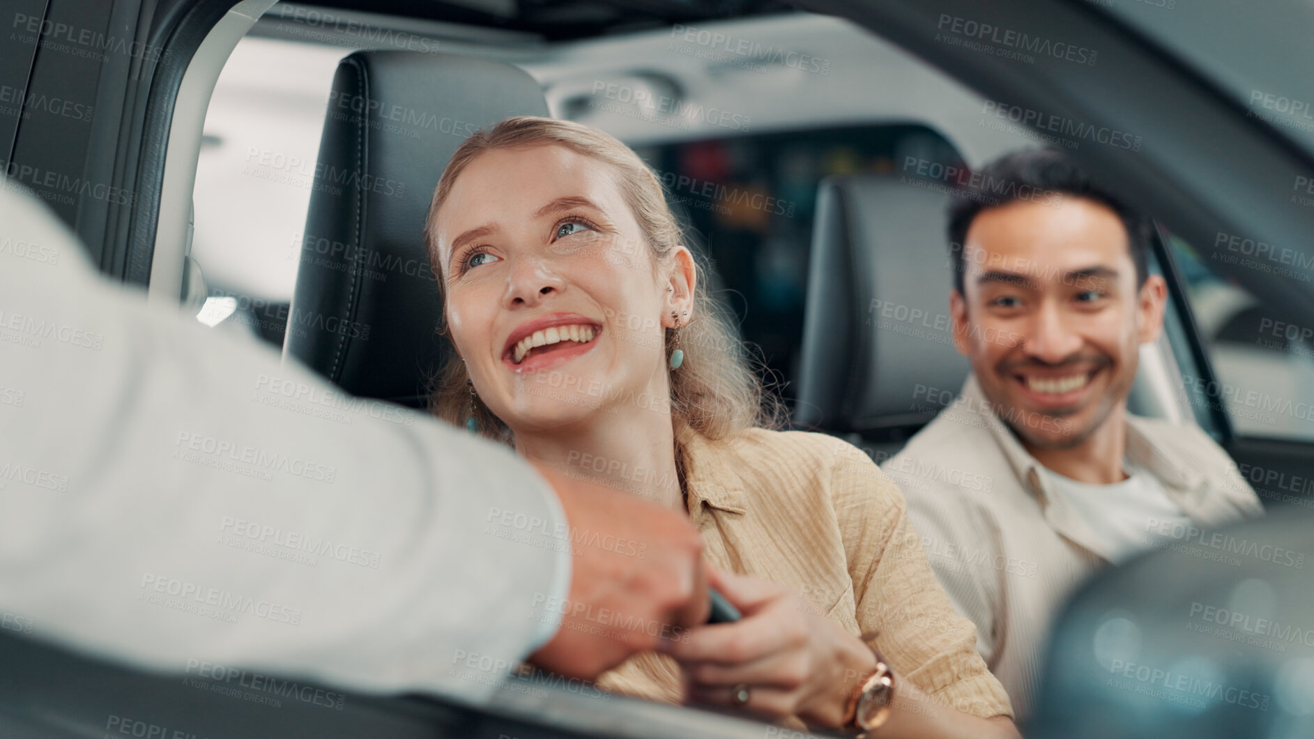 Buy stock photo Keys, car or happy couple in showroom with salesman, smile or investment in auto insurance. Excited, people or buyer in dealership shopping for vehicle finance, customer satisfaction or motor sales